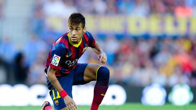 Neymar crouches down on the Camp Nou turf during his Barcelona debut against Levante in 2013. Getty