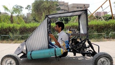 Mahmoud Yasser, mechanical engineering student from Helwan University, drives the air-powered vehicle in Cairo, Egypt. Reuters