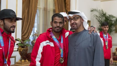 Sheikh Mohammed bin Zayed with members of the UAE Paralympic Games team at the Sea Palace. Mohamed Al Hammadi / Crown Prince Court - Abu Dhabi