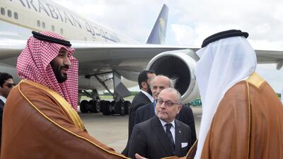 Saudi Arabia's Crown Prince Mohammed bin Salman shakes hands with a Saudi Arabia's embassy official as Argentine Foreign Minister Jorge Faurie watches, at Ministro Pistarini in Buenos Aires, Argentina, November 28, 2018. Argentine G20/Handout via REUTERS ATTENTION EDITORS - THIS IMAGE WAS PROVIDED BY A THIRD PARTY.