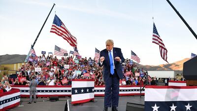 US President Donald Trump dances at the end of a rally at Carson City. AFP