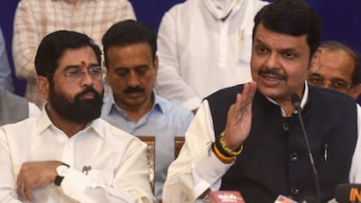 Shiv Sena party leader and chief minister of Maharashtra Eknath Shinde (L) looks on as BJP leader and deputy chief minister Devendra Fadnavis speaks in Mumbai. AFP