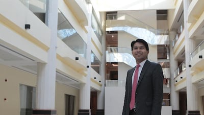 Michael Barney Almazar works with the Philippine Consulate to offer Filipino expatriates free legal advice regarding debt. Jeffrey E Biteng / The National