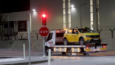 A taxi which was allegedly used by the attackers is removed from the site near the Turkish Aerospace Industries building, after an explosion in Kahramankazan. AFP