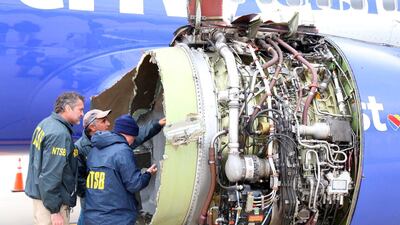 US NTSB investigators examine damage to a Southwest Airlines plane. NTSB / Handout via Reuters