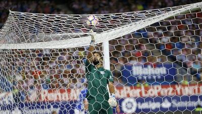 Alaves' goalkeeper Fernando Pacheco pushes the ball from the net. (Francisco Seco/AP)