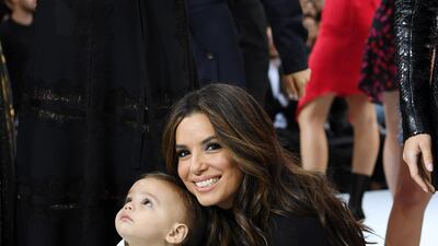 Eva Longoria and her son, Santiago, pose on the runway during the L'Oreal Paris show as part of Paris Fashion Week on September 28, 2019. Getty Images
