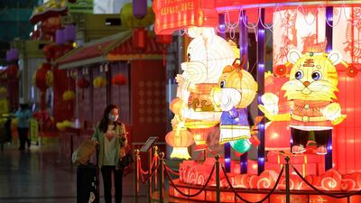 A passenger wears a mask at Guangzhou airport. EPA