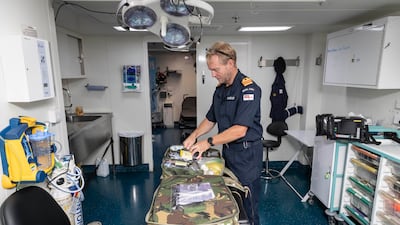 Surgeon and Lt Commander James Eckersley at work.