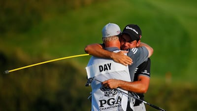 Neither Jason Day nor his caddie/swing coach/father figure Colin Swatton were able to control their emotions at the finish. Kevin C Cox / AFP
