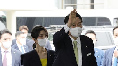 Yoon and Kim arrive at a Hyundai Heavy Industries shipyard to witness the launch a naval destroyer, in July 2022. EPA