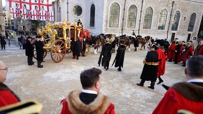 Mr Mainelli walks out to the State Coach at the start of the Lord Mayor's Show. PA