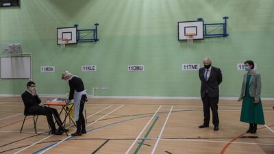 Boris Johnson speaks to a member of staff in the gym. Reuters