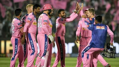 Leg-spinner Shreyas Gopal, centre, celebrates after dismissing Virat Kohli in Jaipur on Tuesday. Money Sharma / AFP