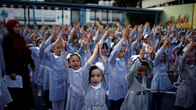 Palestinian schoolgirls participate in morning exercise at an UNRWA-run school in Gaza. Reuters