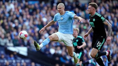 Harry Souttar of Leicester City and Erling Haaland vie for the ball. EPA