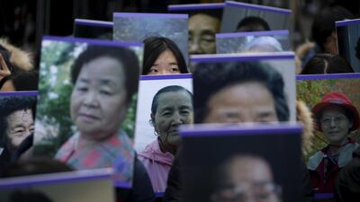 Students hold portraits of deceased former South Korean “comfort women” during a weekly anti-Japan rally in front of Japanese embassy in Seoul, South Korea. Kim Hong-ji / Reuters