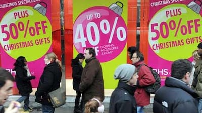 Christmas shoppers look for last minute bargains in London, Britain.