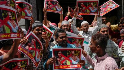 Muslims hold placards during a protest outside a mosque in Mumbai. AP