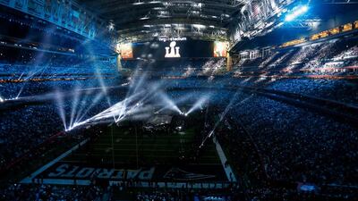 Gaga was patriotic from the start, opening with snippets of God Bless America and This Land is Your Land with red and blue lights twinkling above her. Bob Levey /Getty Images / AFP