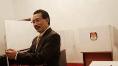 M Wahid Supriyadi, the Indonesian ambassador, inspects the polling station at the embassy.