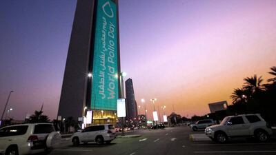 The Adnoc building lit up in honour of World Polio Day, held on October 24 each year. Victor Besa/The National