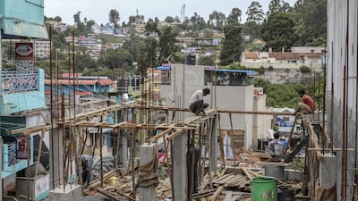 Workers labour at a construction site in India. Two hedge funds have accused developer Ireo Management of fraud. Bloomberg