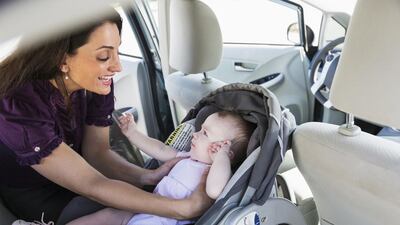 Fitting a car seat is a motoring necessity for parents. iStockphoto.com