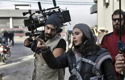 Labaki spent five years making the film. Here she is on set of the film with Christopher Aoun, left and Jad Asmar. Capernaum