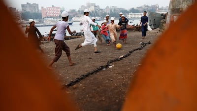 Children play football at dockyard premises in Dhaka, Bangladesh, October 9, 2023. REUTERS / Mohammad Ponir Hossain