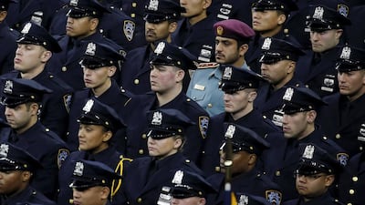 Lt Hamid Al Nuaimi from the Abu Dhabi Police force with other New York Police Department officers at the graduation ceremony. Carlo Allegri / Reuters