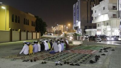 The faithful pray at an open air mosque in Abu Dhabi's Al Wahda neighborhood. Photo: Jaime Puebla / The National