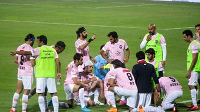 The Bollywood All Stars Football Club plan their Celebrity Football Cup game against Emirates United at Shabab Al Ahli Stadium in Dubai on May 7. All photos: Ruel Pableo for The National