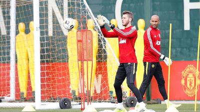 Manchester United goalkeeper David De Gea, left, has just signed a new long-term contract to remain at Old Trafford until at least 2023. PA