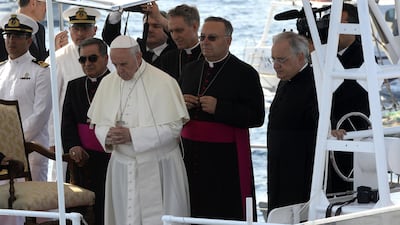 Pope Francis prays for migrants after casting a wreath into the Mediterranean Sea off Lampedusa island, Italy on July 8, 2013. AFP