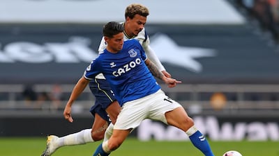 Everton's Colombian midfielder James Rodriguez under pressure from Dele Alli of Spurs. AFP