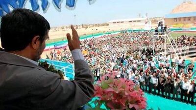 A handout picture released by Mahmoud Ahmadinejad's official website shows the Iranian president waving at supporters during a visit to Abu Musa.