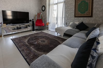 The apartment's living room is big enough to accommodate visitors. Chris Whiteoak / The National