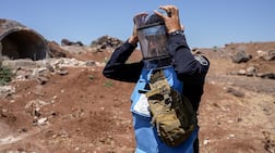Abdel Mohsen Al Masri prepares to detonate the unexploded Russian missile found. Ahmed Fallaha / The National
