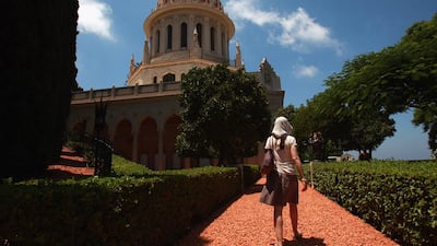 A visitor approaches the golden-domed Shrine of the Bab July 14, 2008 in Haifa, Israel. The world spiritual centre of the Bahai faith and resting place for the remains of their founder Bab, whose devotees number less than six million worldwide, was declared a World Heritage Site by UNESCO. Getty Images