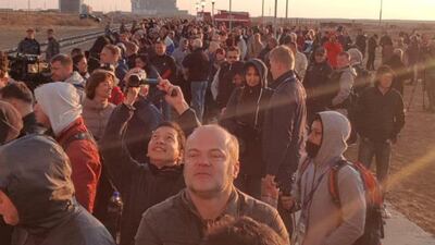 More than 100 relatives, space officials and journalists gather to watch the train arrive early on Monday morning. James Langton / The National