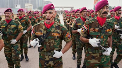 Iraqi soldiers take part in a Baghdad parade to mark the eighth anniversary of the defeat of ISIS. AP