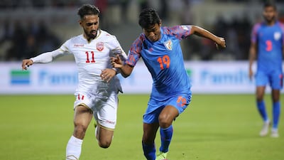Ali Jaafar Madan, left, of Bahrain in action against Hali Charan Narzary of India. EPA