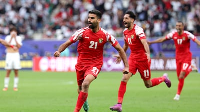 Nizar Al Rashdan of Jordan celebrates scoring his team's third goal. Getty Images