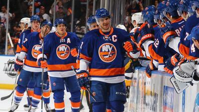 John Tavares, centre, has enjoyed plenty of individual accolades during his five seasons with the New York Islanders but has yet to experience post-season success with his team. Al Bello / AFP