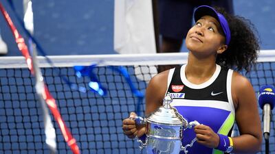 Naomi Osaka celebrates with the US Open trophy after defeating Victoria Azarenka in the final. Reuters