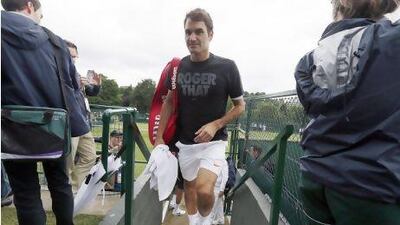 Roger Federer of Switzerland, shown here leaving a training session in London on Sunday, won his first title of the year last week and he is hoping to build on that momentum at Wimbledon, which starts Monday. Stefan Wermuth / Reuters