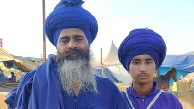 Talwinder Singh, 50, looks after Sartaj Singh, 15, and four other young boys as they train to become Nihang warriors, a 17th-century order founded by last Sikh Guru Gobind Singh. Taniya Dutta for The National