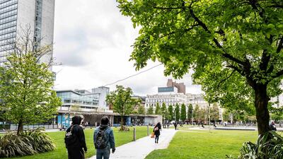 People walk through Piccadilly Gardens. Darren Robinson for The National