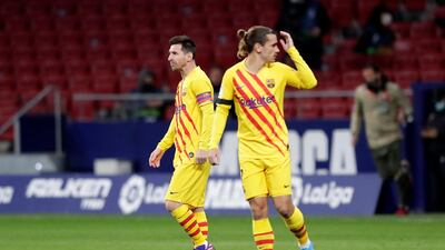 Lionel Messi and Antoine Griezmann during the match between Atletico Madrid and Barcelona. Getty Images